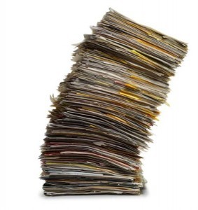 Leaning-stack-of-papers-and-files-283x300